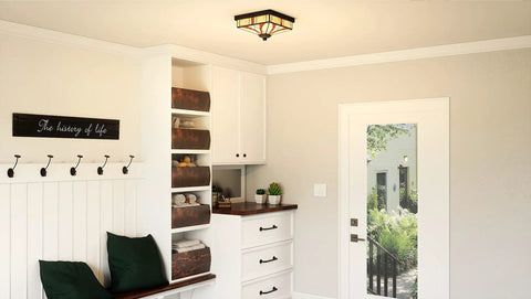 Finley Two Light Valiant Bronze Flush Mount With Multicolored Tiffany Glass Shade in a traditional hallway setting.