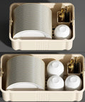 Sleek White Plate Drying Rack And Smart Kitchen Organizer Built With Hella Sturdy Pp Pet Material Offering Massive Counter Storage That Acts As A True Lifestyle Game Changer, featuring stacked plates and cups in a beige storage unit.