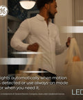 Man carrying bags in hallway with Motion Sensor LED Light Bulbs Outdoor Security, 12W Daylight A21, no hub or WiFi needed.