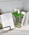Clear Book Vase Acrylic Flower Holder And Space Saving Desk Decor on kitchen counter with tulips and cookbooks.