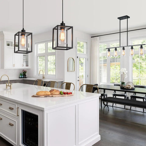 Rock Solid Black Pendant Lights For Kitchen Island, 3 Pack above a modern kitchen island with white cabinetry.
