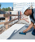 Tough As Nails Stud Finder Wall Scanner With Dead On Digital Display used for scanning concrete on a construction site.