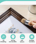 Close-up of Super Slick Three Piece Chalk Wax Paint Brush Set for Furniture Makeovers applying paint to a frame.