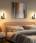 Top Shelf Modern Led Wall Sconces Set Of Two Up And Down Black Metal Fixture With 3000K Warm White Glow Solid Durable Anti Corrosion Coating Real Smooth Matte Finish For Hallway Bedroom Living Room Chill Home Vibes above a cozy bed with gray linens.