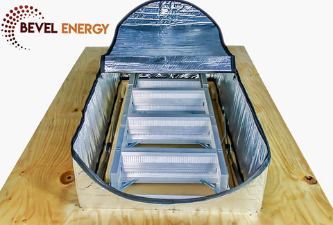 Energy Saving Attic Door Insulation Cover For Stairway Opening 25 By 54 By 11 Inches With Easy Access Zipper Aluminum Insulated Attic Tent Quick Install Keeps Drafts Out And Heat In, showing aluminum cover on wooden frame with stairs inside.