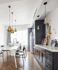Modern kitchen with black cabinets featuring Brass Gold Cabinet Handles 30 Pack 5 Inch Hole Center Drawer Pulls Modern Bar Style.