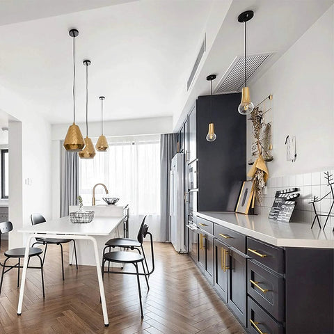 Modern kitchen with black cabinets featuring Brass Gold Cabinet Handles 30 Pack 5 Inch Hole Center Drawer Pulls Modern Bar Style.