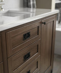 Matte Black Five Pack Cabinet Handles With Three Inch Center To Center Spacing Vintage Drawer Pulls For Kitchens Cabinets Doors And Dressers Durable Metal Hardware For Quick Home Refresh installed on a wooden cabinet under a white countertop sink.