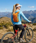 Person biking with 5L Hydration Vest Backpack With 2L Water Bladder, Ultra Lightweight Quick Dry Nylon Mesh Pack For Hiking And Trail Running, Orange