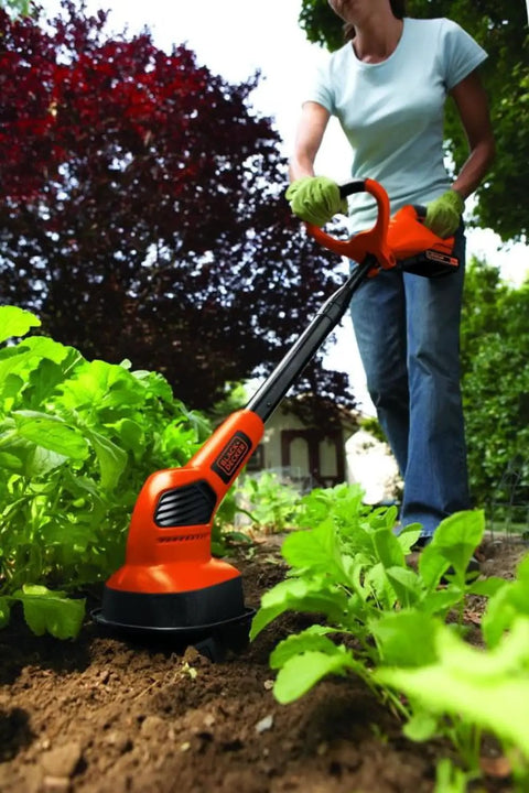 Woman using 20V Max Cordless Garden Tiller Kit PowerConnect Tool Only With Dual Tines For Cultivating Beds Weeding Aerating and Prepping Dry