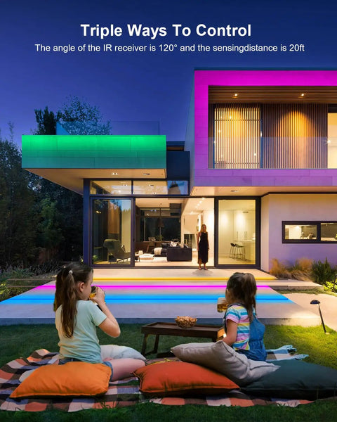 Outdoor night scene with modern house lit by 65.6 Ft Waterproof LED Strip Lights With Remote, children playing on lawn