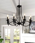 Industrial Candle Chandelier In Black Iron With Eight Lights hanging in modern farmhouse living room, visible with ceiling beams.