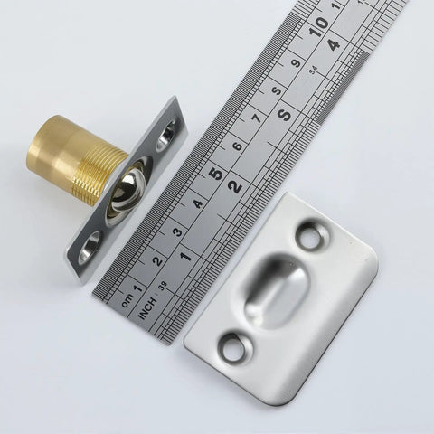 Close-up of Two Pack Go-To Adjustable Ball Catch Closet Door Latches in silver finish with brass pin, shown with ruler.