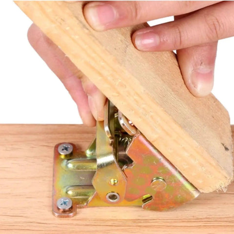 Hands installing Tough As Nails Table Leg Folding Brackets 4 Pack Heavy Duty Self Locking Hinges on wood surface.