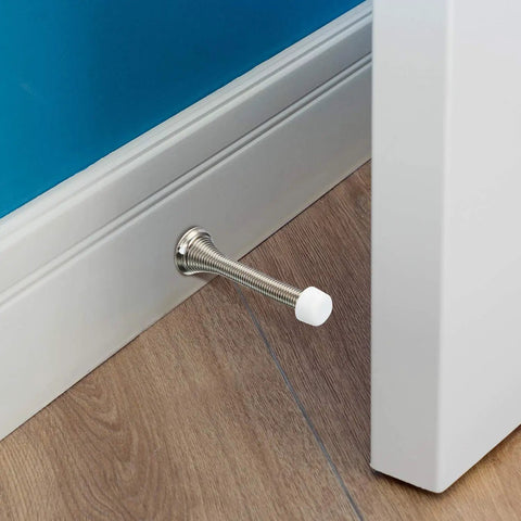 Installed door stop with 15 Pcs Door Stop Tips Replacement Caps 0.32 Inch Universal Rubber Bumper Stud Tips For Baseboard And Wall Mount Door Stops White