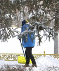 Person shoveling snow using Spade Handle Replacement For Snow Shovels With 32mm Inner Diameter Plastic D Grip Style, yellow handle
