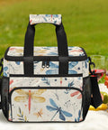 Close-up of insulated picnic backpack with detachable lunch bag, butterfly print, outdoor picnic setting.