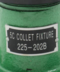 Close-up of green Dual Orientation 5C Collet Fixture Holder 225-202B for milling, grinding, drilling with metal label.