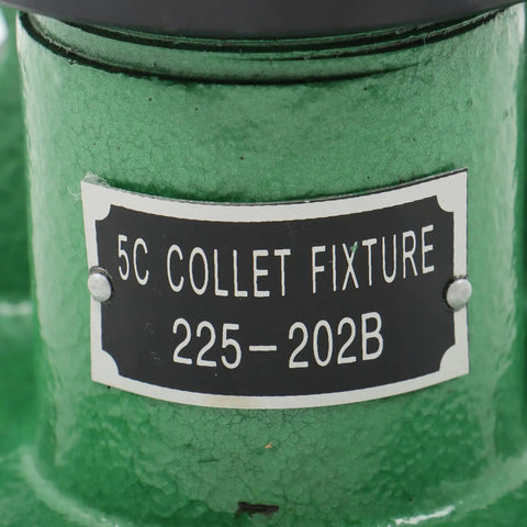 Close-up of green Dual Orientation 5C Collet Fixture Holder 225-202B for milling, grinding, drilling with metal label.