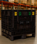 Rugged Collapsible Bulk Storage Container Featuring Four Way Forklift Access And Two Drop Doors Standard Duty Stacking Pallet Box With One Thousand Seven Hundred Pound Capacity in warehouse.