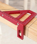 Red 3D Multi Angle Measuring Ruler For Woodworking And Carpentry, 45 And 90 Degree Aluminum Alloy Square Protractor on wood beam