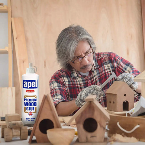 Person crafting with Go-To Water Resistant Wood Glue 16 Oz Two Pack Clear PVA Adhesive For Woodworking And Hobbies.