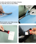 Using Pro Grade Car Window Tint And Vinyl Wrap Tool Kit With 1800W Heat Gun 110V for precise vinyl and sticker cuts.