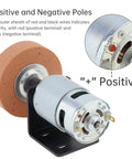 RS775 Compact DC Motor Sander Polisher Kit 12V 24V 120W Brushed Build With 5Mm Shaft showing motor with positive and negative poles.