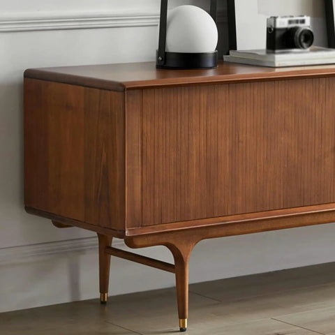 Top Shelf Retro TV Stand Featuring Two Spacious Drawers And Dual Wood Locker Doors Paired With Heavy Duty Media Console And No Sweat Storage Cabinet For A Sweet Family Hangout Space, wooden surface with stylish lamp and camera.