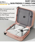 Open pink lightweight underseat carry-on luggage showing compartments with cross straps and PVC waterproof pocket.