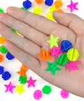 Hand holding Colorful Bike Wheel Spoke Beads Set With Round And Star Shapes, 72 Pieces, Easy Clip On Spoke Decorations