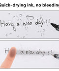 Rollerball Pens 0.5 Mm Fine Tip Black Ink 12 Pack showing quick-drying ink, no bleeding on paper with water drops.