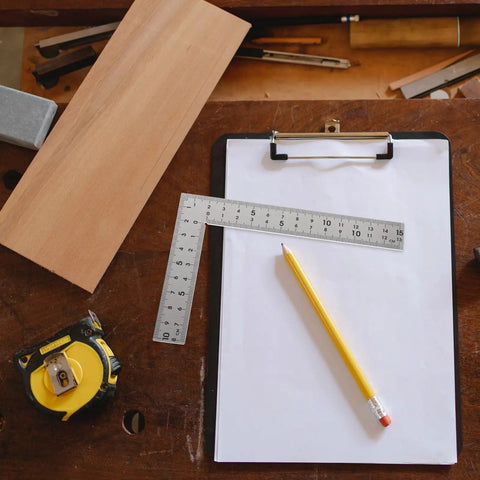 Versatile Woodworking Tool Stainless Steel Carpenter Square Ruler With Double Sided Scales 10x15cm on a clipboard with pencil