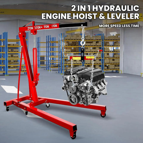 Rock Solid Engine Hoist And Folding Hydraulic Crane Featuring Six Low Friction Casters Built In Leveler Tilt Control And Heavy Duty Steel Shop Workhorse Handling 2 Ton 4400 Lbs Loads in a shop setting with an engine.