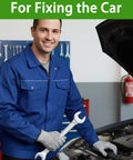 Mechanic wearing cut-resistant gloves holding a wrench by an open car hood in a workshop.