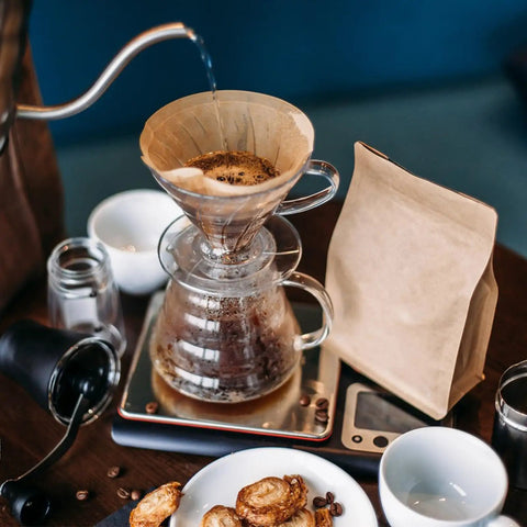 Solid Daily Driver Number Four Cone Coffee Filter Papers brewing coffee with clean water pouring, unbleached paper filter in use.