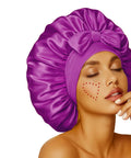 Woman wearing Silky Satin Sleep Bonnet With Adjustable Straps For Women Ultra Comfortable And Skin Friendly No Slip Fit in rich purple