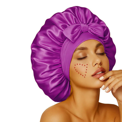 Woman wearing Silky Satin Sleep Bonnet With Adjustable Straps For Women Ultra Comfortable And Skin Friendly No Slip Fit in rich purple