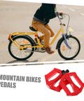 Child riding bike with 2 Pack Mountain Bike Pedals For Kids And Adults, comfy, grippy, stable bike pedals shown in red.