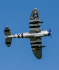 1.2m P-47 Razorback RC Airplane BNF Basic Ready To Fly Without Transmitter Or Charger in flight, displaying full wing detail