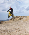 Heavy Duty Electric Dirt Bike Two Pack Crafted For Teens And Adults Packing 5500W motors jumping on sandy terrain