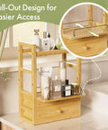 Bamboo Bathroom Countertop Organizer With 2 Tier Makeup Storage And 2 Drawers, featuring pull-out tray and skincare items.