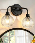 TODOLUZ 2-Light Clear Ribbed Glass Wall Sconce Lighting, Modern Farmhouse Bathroom Vanity Lighting Over Mirror for Kitchen Hallway Living Room, E26 Bulb Base with ribbed glass shades.