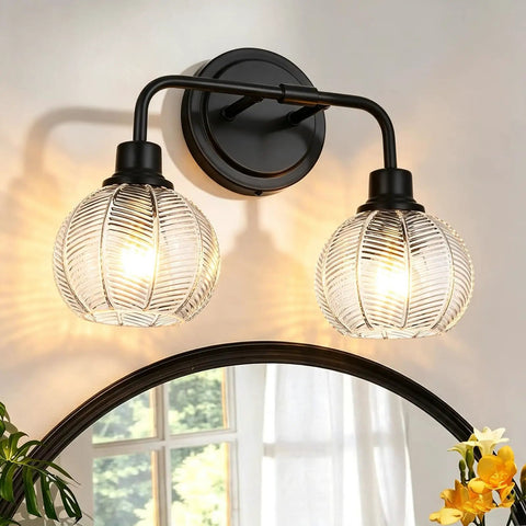 TODOLUZ 2-Light Clear Ribbed Glass Wall Sconce Lighting, Modern Farmhouse Bathroom Vanity Lighting Over Mirror for Kitchen Hallway Living Room, E26 Bulb Base with ribbed glass shades.
