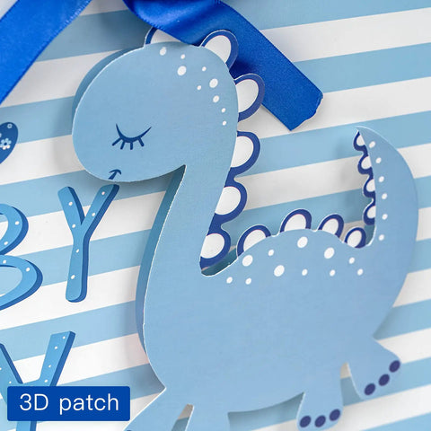 Blue Dinosaur Baby Boy Gift Bag With Tissue Paper And Greeting Card Durable Ribbon Handles And Reinforced Bottom 13 By 10 By 5 Inches Perfect For Baby Showers New Parents And More featuring a 3D baby dinosaur design on striped background.