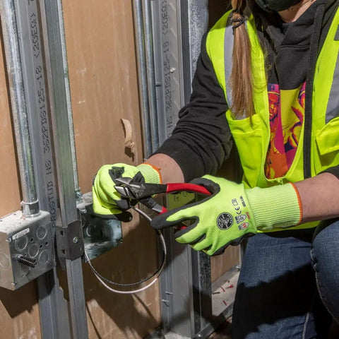 Electrician using Diagonal Cutting Pliers Eight Inch High Leverage With Short Jaws And Beveled Cutting Edges Induction Hardened Knives