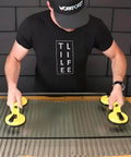 Person using Heavy Duty Aluminum Suction Cups With Vacuum Handle Glass And Tile Lifter for lifting large glass, ergonomic grip focus.