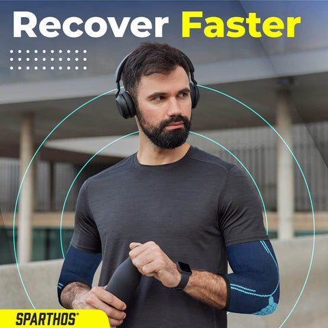 Man wearing elbow compression sleeves for pain relief and support, on the go comfort, boosts blood flow, large, flamingo pink.