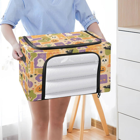 Heavy Duty Foldable Storage Bin With Large Clear Window And Dual Zipper Openings For Quick Grab Access Interior Steel Frame Keeps Structure Intact Festive Pumpkin Ghost Art Collage held in hands, ideal for storage.