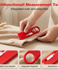 Hands using a multifunctional tool with ruler and magnifier on fabric, focusing on 4 In 1 Sewing Threader Tool With Seam Ripper Needle Threader Magnifying Glass And Magnetic Sewing Accessory For Easy Threading And Quick Stitch Removal Compact Handheld Helper Blue.